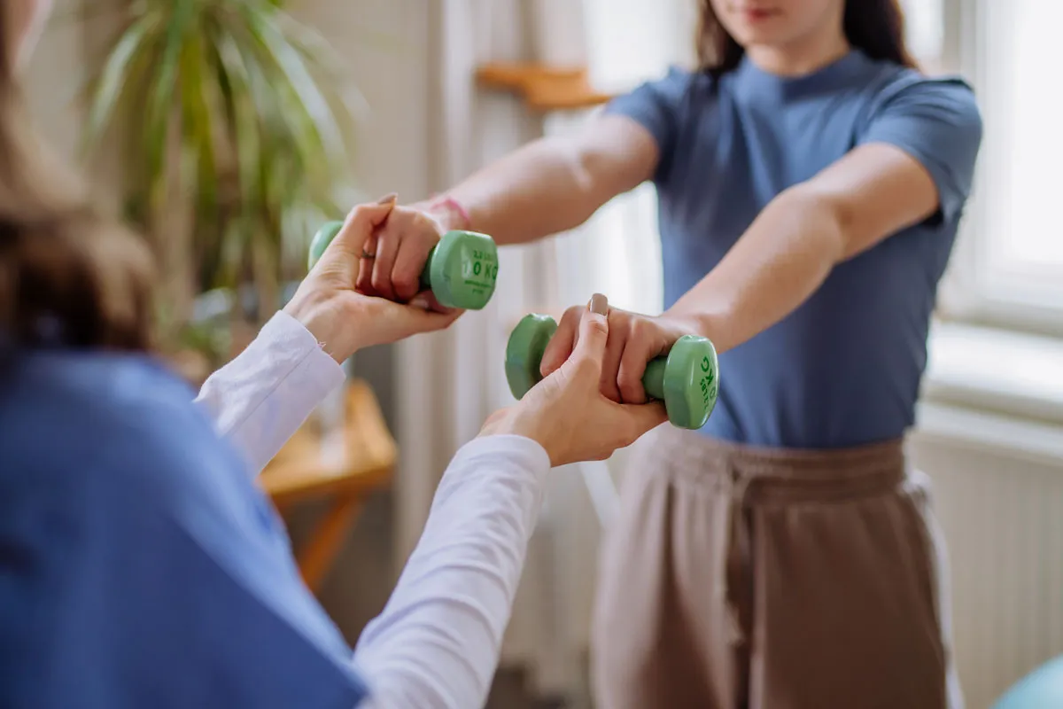 teenage girl doing exercise with a nurse 2023 11 27 05 31 27 utc